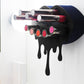 Black Small Lip Design Lipstick Organizer holding 10 lipsticks mounted on the wall with lipstick easily accessible and organized. Hanging Lipstick Holder that looks like wall art. 