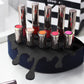 Small Lip Design Lipstick Organizer holding 10 lipsticks mounted on the wall with lipstick easily accessible and organized. Hanging Lipstick Holder that looks like wall art. Shown sitting on a makeup vanity.