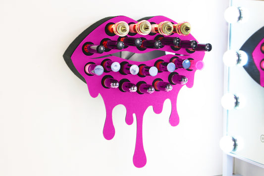Dark Pink Medium Lip Design Lipstick Organizer holding 23 lipsticks mounted on the wall, keeping lipstick organized and easy to reach. This wall mounted makeup organizer looks like art on the wall of your bathroom or makeup room.