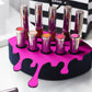 Small Lip Design Lipstick Organizer holding 10 lipsticks mounted on the wall with lipstick easily accessible and organized. Hanging Lipstick Holder that looks like wall art. Shown sitting on a makeup vanity.