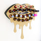 Gold Medium Lip Design Lipstick Organizer holding 23 lipsticks mounted on the wall, keeping lipstick organized and easy to reach. This wall mounted makeup organizer looks like art on the wall of your bathroom or makeup room.
