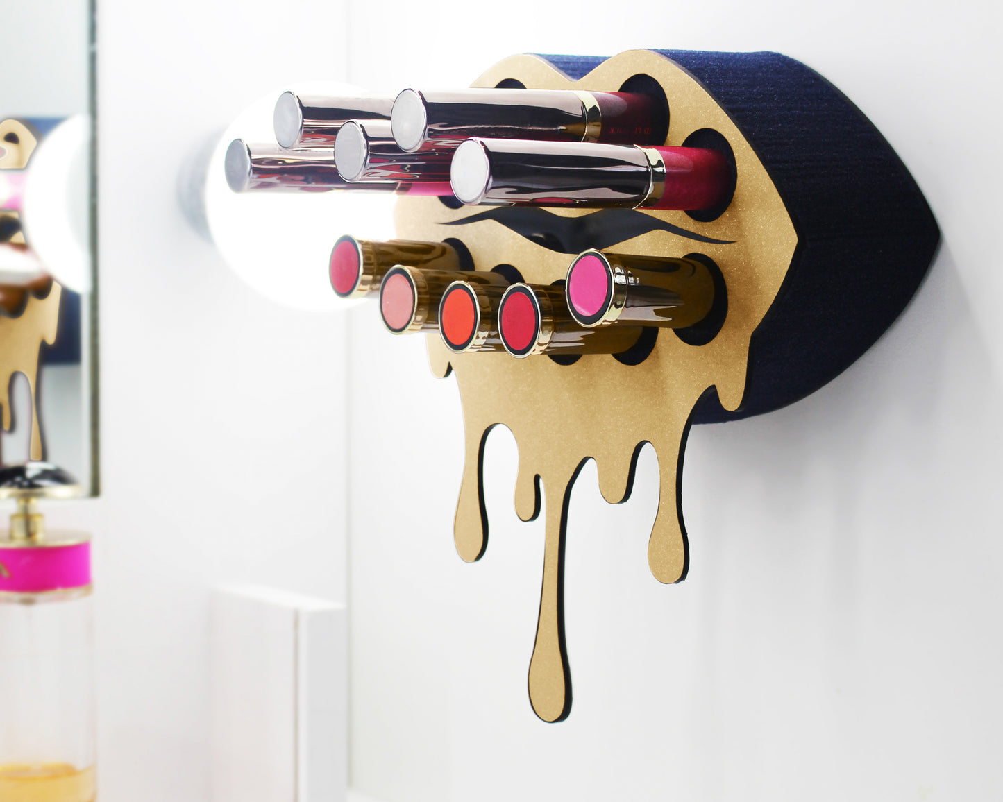 Black Small Lip Design Lipstick Organizer holding 10 lipsticks mounted on the wall with lipstick easily accessible and organized. Hanging Lipstick Holder that looks like wall art.