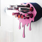 Black Small Lip Design Lipstick Organizer holding 10 lipsticks mounted on the wall with lipstick easily accessible and organized. Hanging Lipstick Holder that looks like wall art.