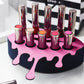 Small Lip Design Lipstick Organizer holding 10 lipsticks mounted on the wall with lipstick easily accessible and organized. Hanging Lipstick Holder that looks like wall art. Shown sitting on a makeup vanity.