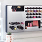 Mirror Silver Ultra Complete Makeup Solution Organizer shown mounted on the wall holding lipsticks, lip glosses, nail polishes, brushes, sunglasses and more by keeping items accessible and off of the counter. Shown next to a makeup vanity with samples of suggested items the organizer can hold. Tilted to the right to show the wall mounted makeup organizer at a different angle while still on the wall.