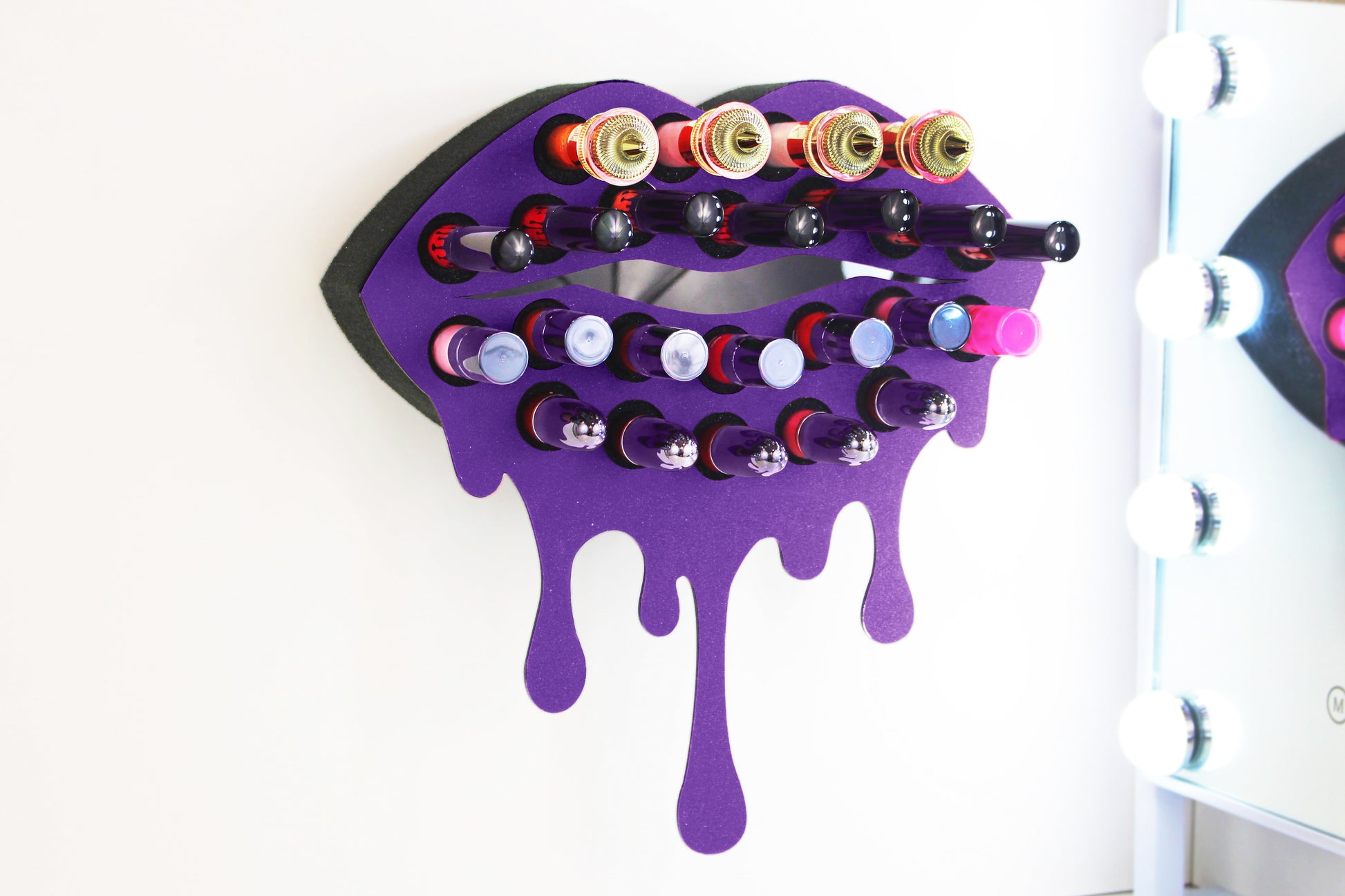 Medium Lip Design Lipstick Organizer holding 23 lipsticks mounted on the wall, keeping lipstick organized and easy to reach. This wall mounted makeup organizer looks like art on the wall of your bathroom or makeup room.