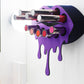 Black Small Lip Design Lipstick Organizer holding 10 lipsticks mounted on the wall with lipstick easily accessible and organized. Hanging Lipstick Holder that looks like wall art.