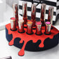 Small Lip Design Lipstick Organizer holding 10 lipsticks mounted on the wall with lipstick easily accessible and organized. Hanging Lipstick Holder that looks like wall art. Shown sitting on a makeup vanity.