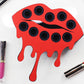 Empty Small Lip Design Lipstick Organizer holding 10 lipsticks mounted on the wall with lipstick easily accessible and organized. Hanging Lipstick Holder that looks like wall art. Shown with lipstick next to the organizer.